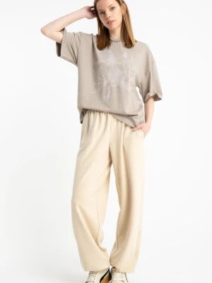 Kremowe spodnie dresowe OVERSIZE bez nadruków Reporter