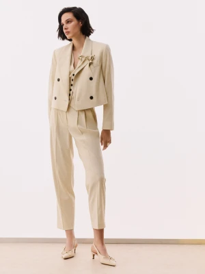 Kremowe spodnie garniturowe z zakładkami TARANKO