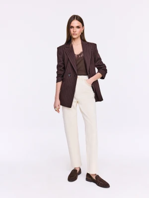 Kremowe spodnie jeansowe z ozdobnym haftem TARANKO