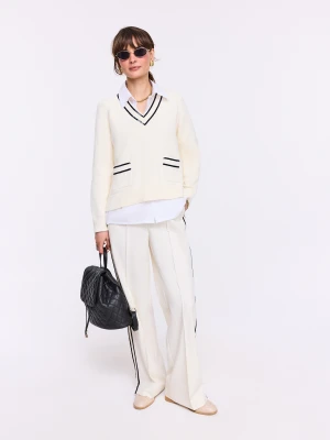 Kremowe spodnie z czarnymi lamówkami TARANKO