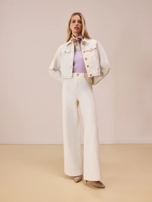Kremowe spodnie z denimu o fasonie wide leg TARANKO