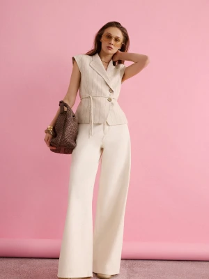 Kremowe spodnie z denimu o fasonie wide leg TARANKO