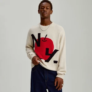 Kremowy bawełniany sweter z okrągłym dekoltem i motywem Big Apple House