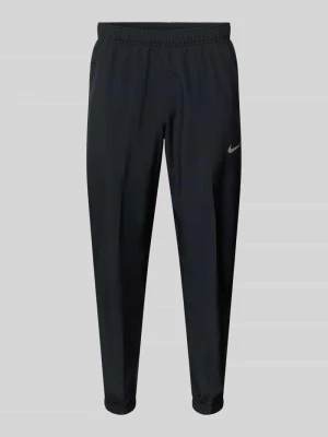 Kształt spodnie z nadrukiem z logo i kieszeniami wpuszczanymi Nike Training