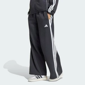 Kultowe spodnie dresowe z szerokimi nogawkami z regulowanymi wiązaniami Adidas