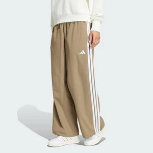 Kultowe spodnie dresowe z szerokimi nogawkami z regulowanymi wiązaniami Adidas