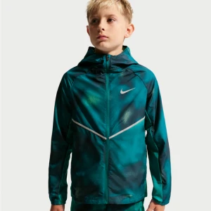 Kurtka dla dużych dzieci z ochroną przed promieniowaniem UV + wodoodporna Nike Miler - Niebieski
