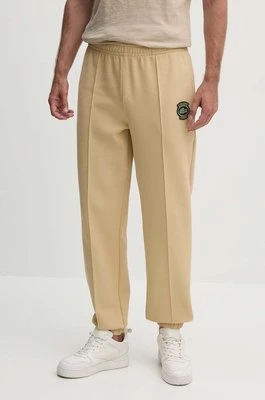 Lacoste spodnie dresowe kolor beżowy gładkie