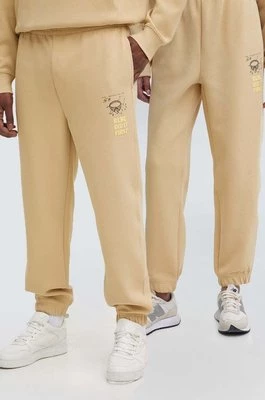Lacoste spodnie dresowe kolor beżowy z nadrukiem