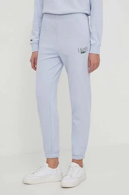 Lacoste spodnie dresowe kolor niebieski z nadrukiem