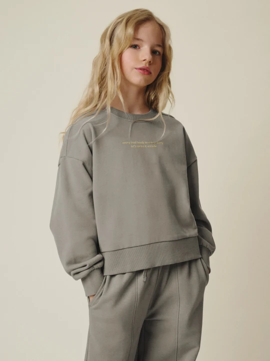 Zdjęcie produktu 4F Bluza dresowa loose bez kaptura dziewczęca - szara 134/140 (8-10 lat) Beżowy