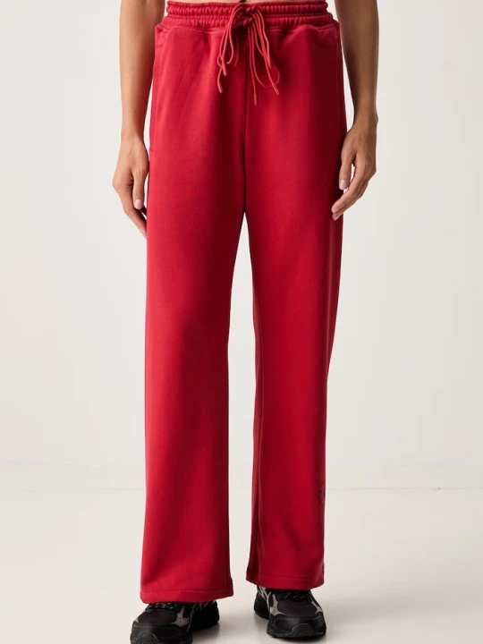 Zdjęcie produktu adidas by Stella McCartney spodnie dresowe damskie z bawełną czerwony