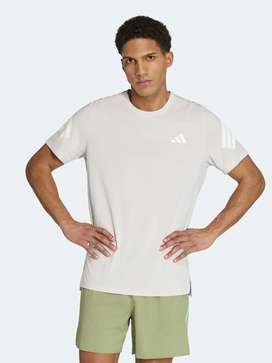 Zdjęcie produktu adidas Koszulka w kolorze beżowym do biegania rozmiar: M