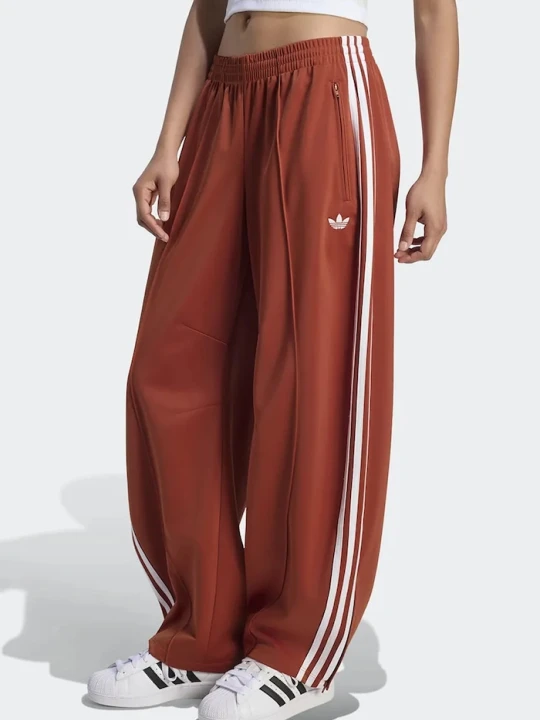 Zdjęcie produktu adidas Originals spodnie dresowe damskie Firebird Barrel pomarańczowy