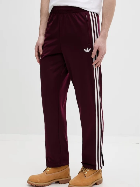 Zdjęcie produktu adidas Originals spodnie dresowe Firebird bordowy