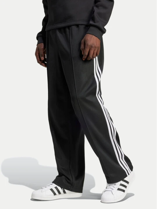 Zdjęcie produktu adidas Spodnie dresowe adicolor Firebird IZ4801 Czarny Baggy Fit