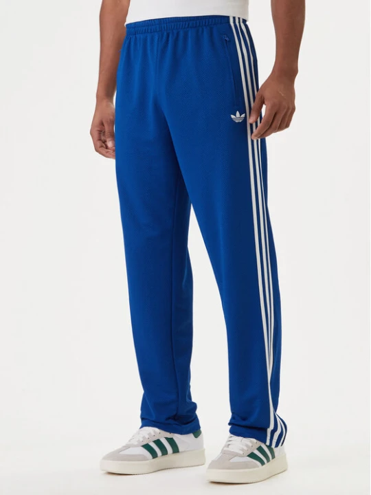 Zdjęcie produktu adidas Spodnie dresowe adicolor Firebird KD4079 Niebieski Regular Fit