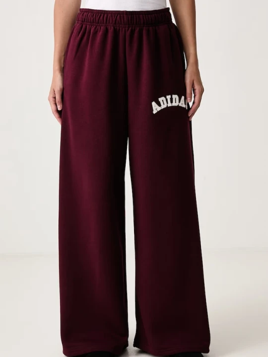 Zdjęcie produktu adidas spodnie dresowe damskie z bawełną Chenille Pack bordowy