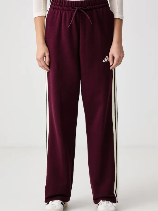Zdjęcie produktu adidas spodnie dresowe damskie z bawełną Essentials bordowy