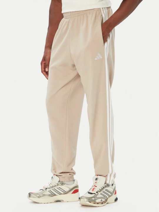 Zdjęcie produktu adidas Spodnie dresowe Essentials 3-Stripes French Terry Tapered Cuffed KY4196 Beżowy Regular Fit