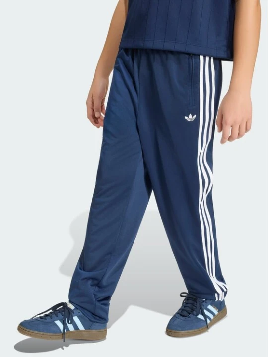 Zdjęcie produktu adidas Spodnie dresowe Firebird HZ6650 Granatowy Regular Fit