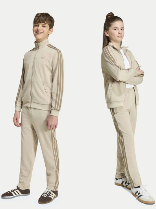 Zdjęcie produktu adidas Spodnie dresowe Firebird HZ6652 Beżowy jasny Regular Fit