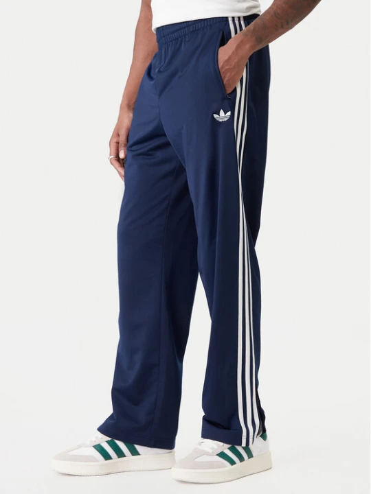 Zdjęcie produktu adidas Spodnie dresowe Firebird KD8316 Granatowy Loose Fit