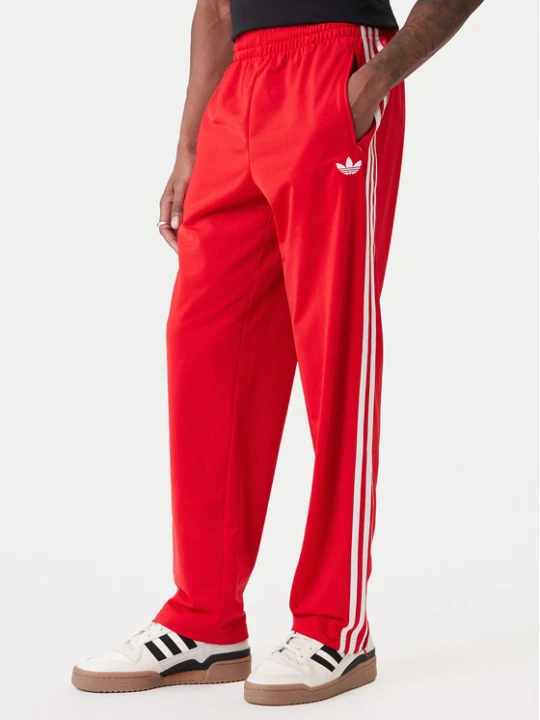 Zdjęcie produktu adidas Spodnie dresowe Firebird KD8319 Czerwony Loose Fit