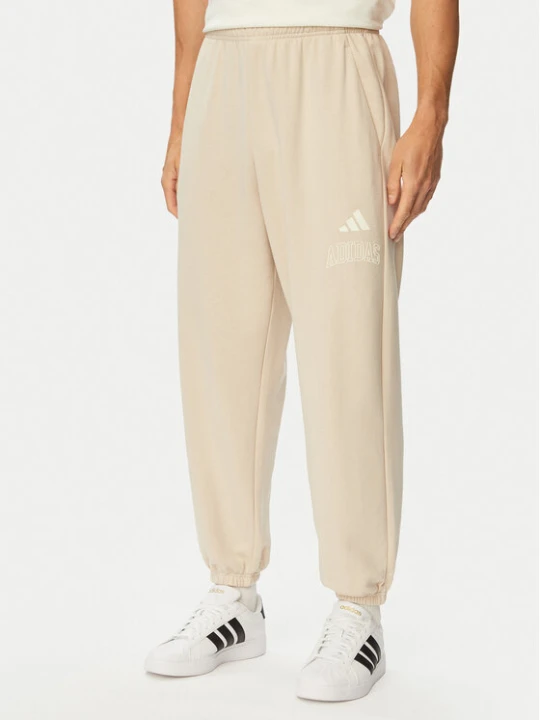 Zdjęcie produktu adidas Spodnie dresowe Seasonal Essentials Collegiate French Terry Cuffed KF4265 Beżowy Regular Fit
