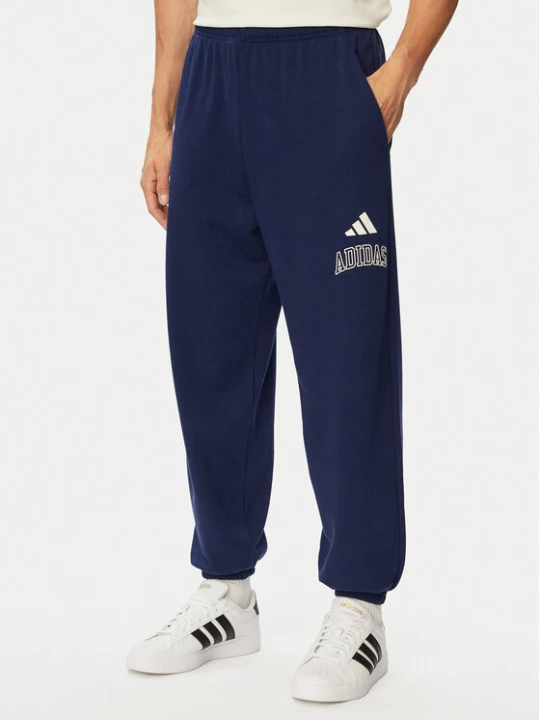 Zdjęcie produktu adidas Spodnie dresowe Seasonal Essentials Collegiate French Terry Cuffed KG0521 Granatowy Regular Fit