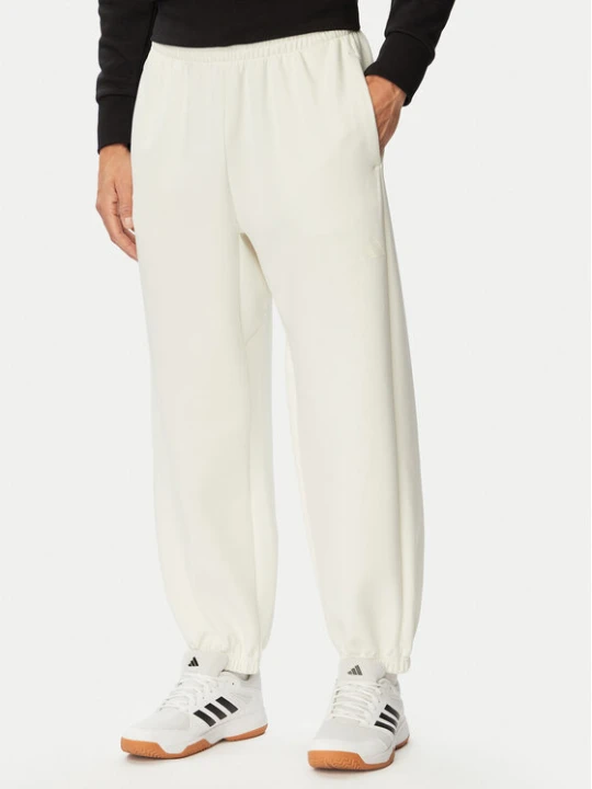 Zdjęcie produktu adidas Spodnie dresowe Soft Lux KF8574 Kremowy Regular Fit