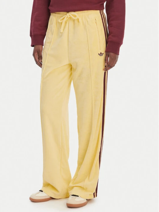 Zdjęcie produktu adidas Spodnie dresowe Terry Towel Firebird KQ6662 Żółty Loose Fit