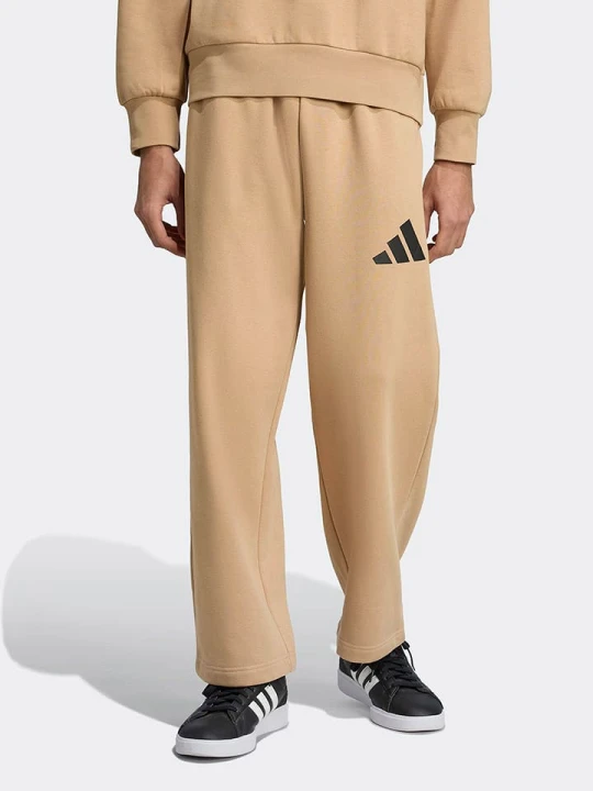 Zdjęcie produktu adidas Spodnie dresowe w kolorze beżowym rozmiar: L