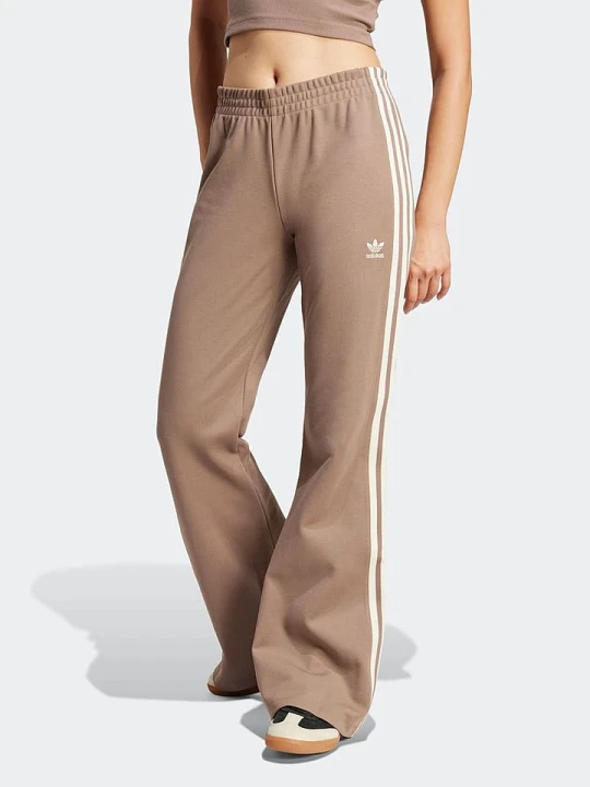 Zdjęcie produktu adidas Spodnie dresowe w kolorze beżowym rozmiar: M
