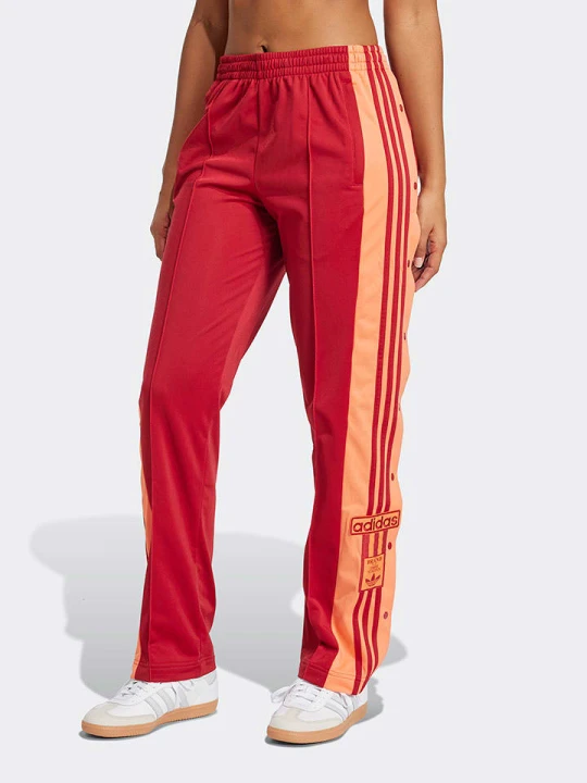 Zdjęcie produktu adidas Spodnie dresowe w kolorze czerwono-pomarańczowym rozmiar: XL