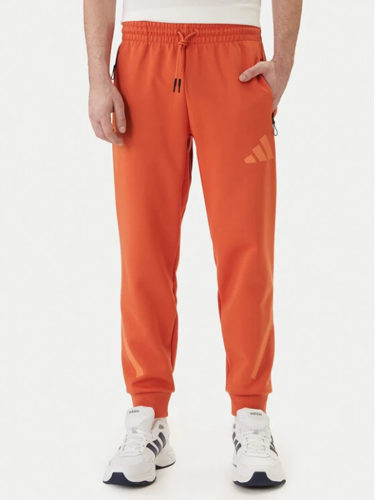 Zdjęcie produktu adidas Spodnie dresowe Z.N.E. KE4686 Pomarańczowy Regular Fit