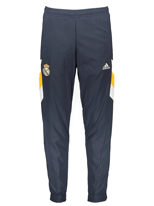 Zdjęcie produktu adidas Spodnie sportowe "Real Madrid" w kolorze granatowo-żółtym rozmiar: L