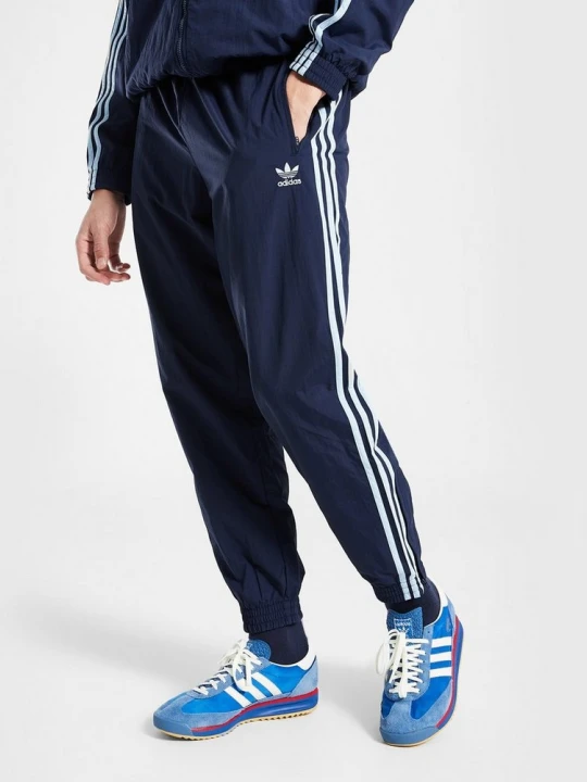 Zdjęcie produktu adidas Spodnie Firebird Woven granatowy