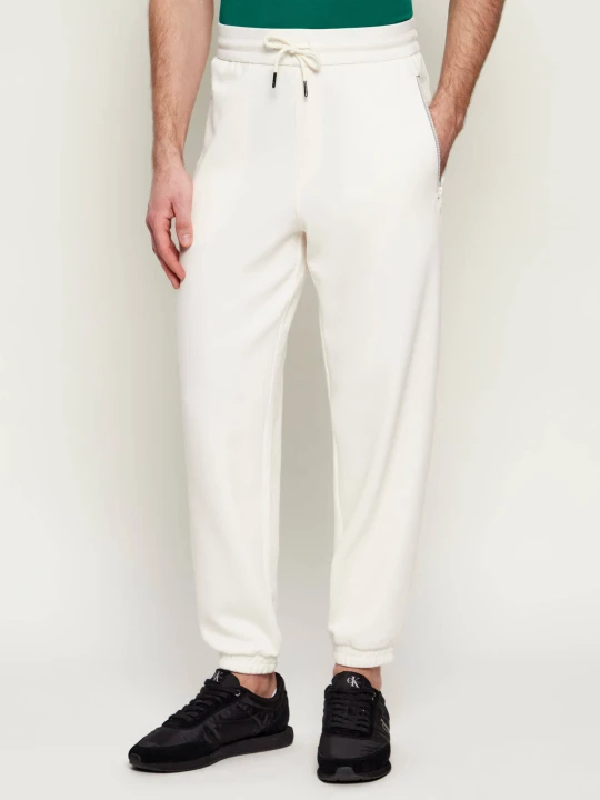 Zdjęcie produktu Armani Exchange Spodnie dresowe | Regular Fit kremowy