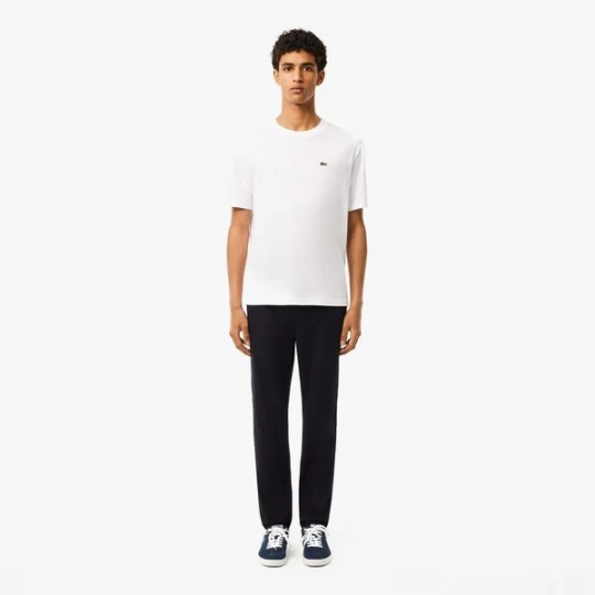 Zdjęcie produktu Bawełniane dopasowane spodnie chino Lacoste