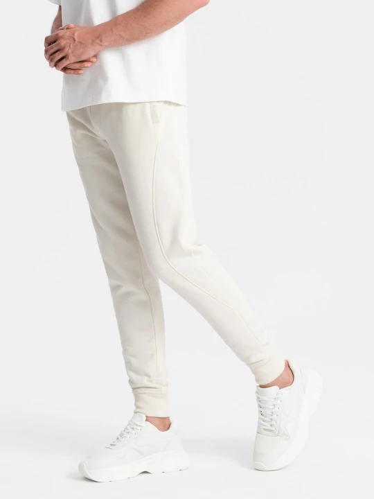Zdjęcie produktu Bawełniane męskie dresowe spodnie joggery BASIC – kremowe V5 - Rozmiar: XXL Ombre Clothing kremowy