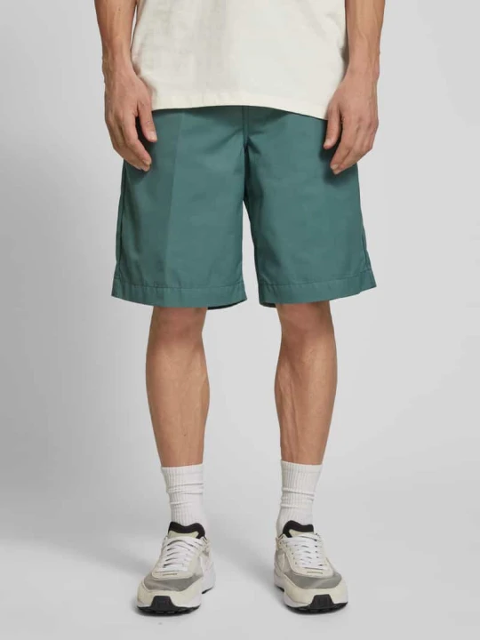 Zdjęcie produktu Bermudy z kieszeniami z tyłu model ‘CRAFT SHORT’ Carhartt WIP Ciemnozielony