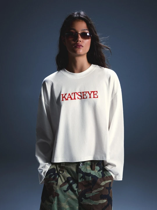 Zdjęcie produktu Bershka Koszulka Z Długim Rękawem Z Nadrukiem Katseye Kobieta Biały Złamany
