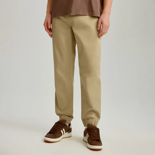 Zdjęcie produktu Beżowe joggery z zaszewkami basic House