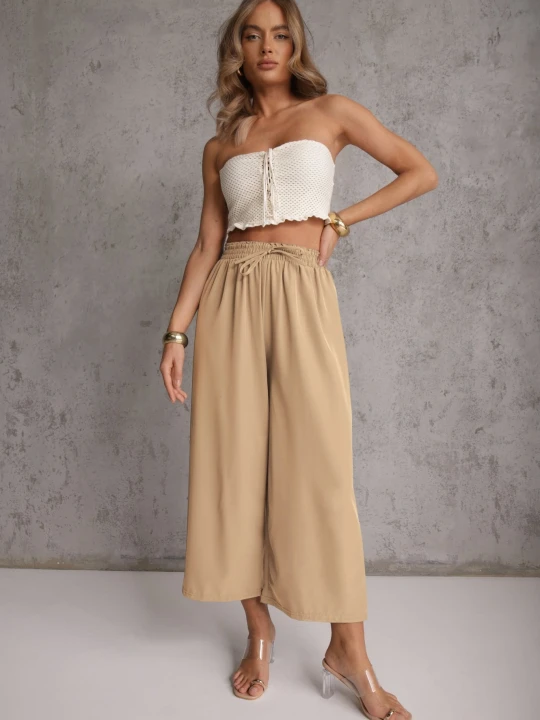 Zdjęcie produktu Beżowe Spodnie High Waist z Szerokimi Nogawkami z Wiskozą Wykończone Gumką w Talii Crisantas Defox