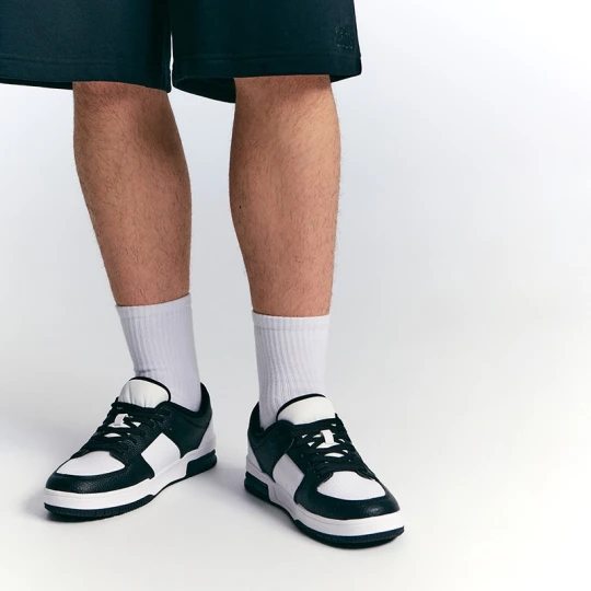 Zdjęcie produktu Biało-czarne sneakersy ze sztucznej skóry House