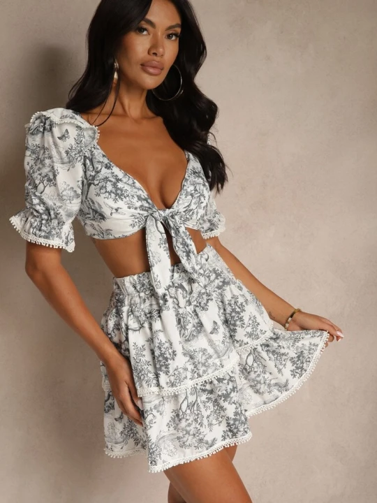Zdjęcie produktu Biało-Czarny Komplet Bluzka Ozdobiona Wiązaniem i Spódnica z Lamówką Halanisa New Collection