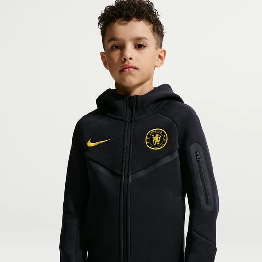 Zdjęcie produktu Bluza do piłki nożnej z kapturem i zamkiem na całej długości dla dużych dzieci (chłopców) Nike Chelsea F.C. Tech Fleece - Niebieski