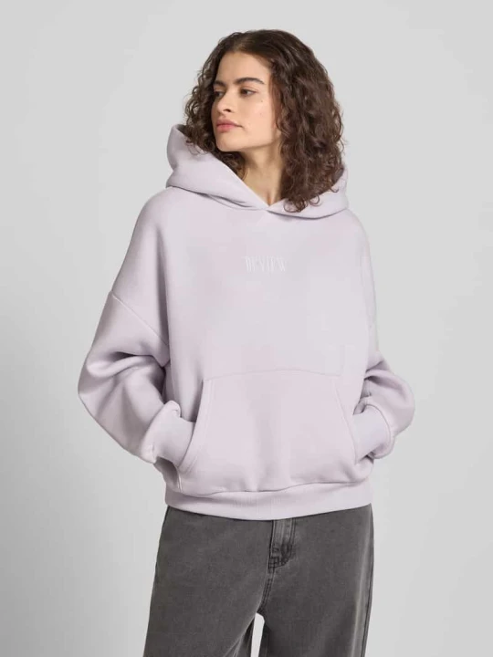 Zdjęcie produktu Bluza dresowa o kroju relaxed fit z nadrukiem logo REVIEW Jasnofioletowy