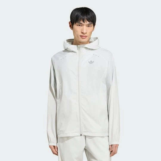 Zdjęcie produktu BLUZA DRESOWA Z KAPTUREM I SUWAKIEM NA CAŁEJ DŁUGOŚCI TECH TREFOIL ESSENTIALS Adidas Orbit Grey